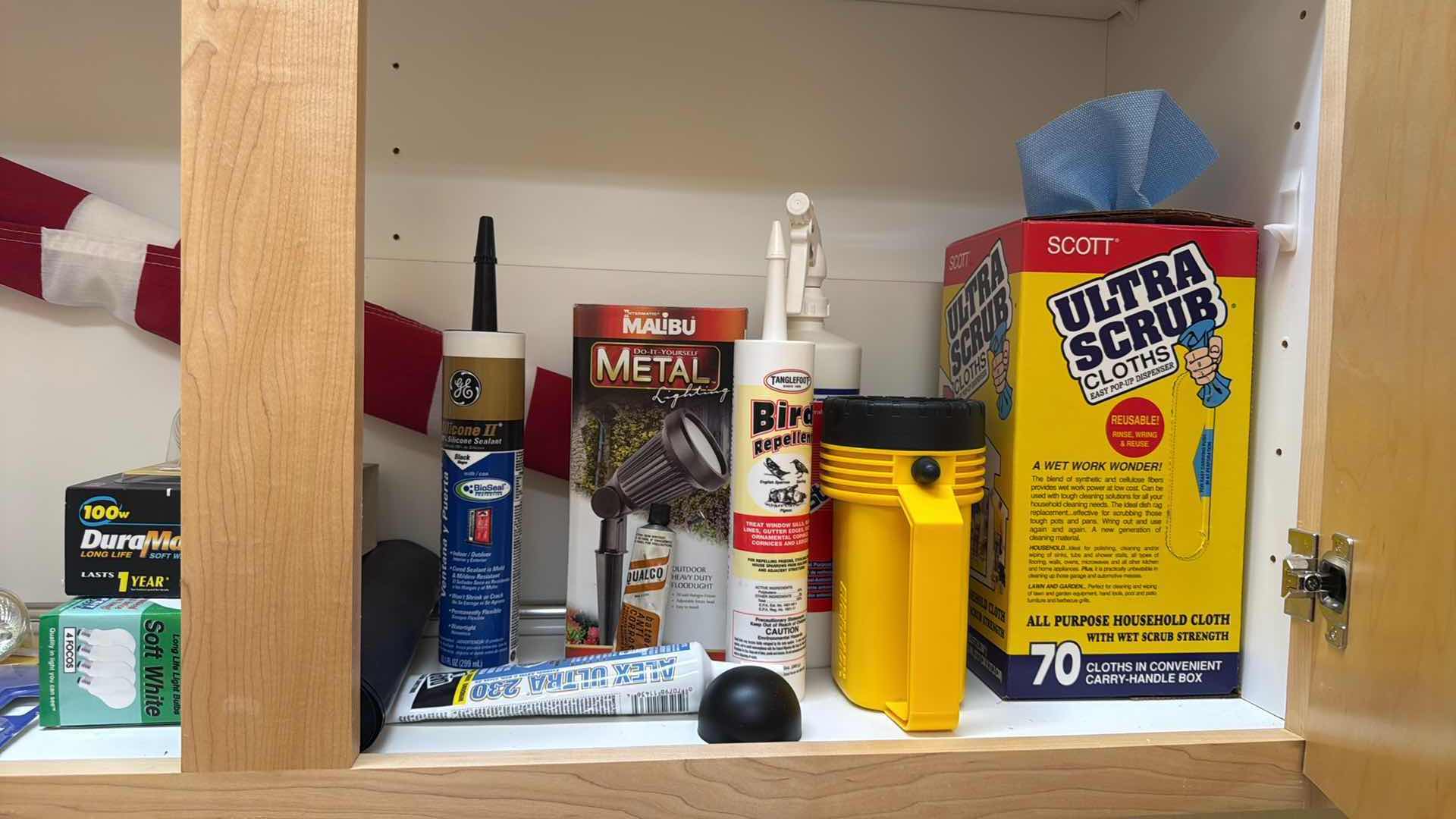 Photo 1 of CONTENTS OF LAUNDRY ROOM CABINET-MISC SUPPLIES,AMERICAN FLAG