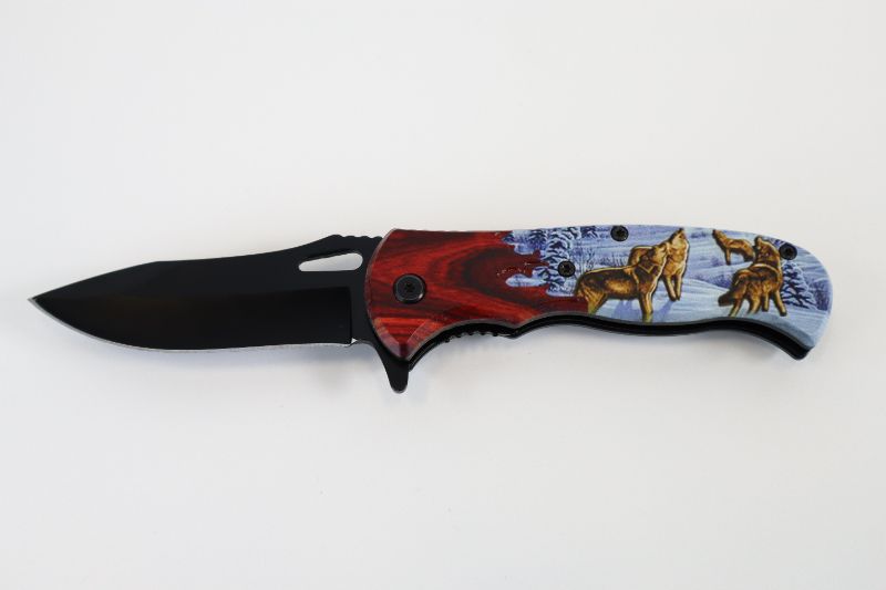 Photo 1 of WOLVES WITH SNOW POCKET KNIFE NEW 