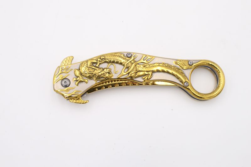 Photo 1 of GOLD AND WHITE CURVED DRAGON POCKET KNIFE NEW 