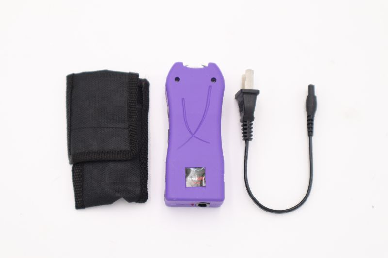 Photo 2 of PURPLE TASER WITH CASE AND CHARGER   NEW 