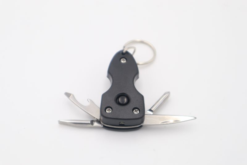 Photo 1 of BLACK 2.5 INCH MULTI TOOL WITH FLASH LIGHT KNIVE BOTTLE OPENER FLAT HEAD AND REGULAR SCREWDRIVER NEW 