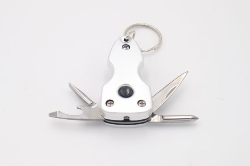 Photo 1 of SILVER2.5 INCH MULTI TOOL WITH FLASH LIGHT KNIVE BOTTLE OPENER FLAT HEAD AND REGULAR SCREWDRIVER NEW 