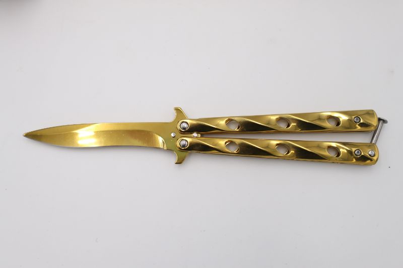 Photo 1 of GOLD BUTTERFLY KNIFE NEW