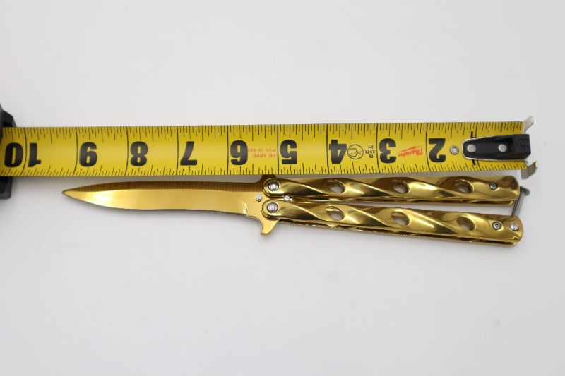 Photo 2 of GOLD BUTTERFLY KNIFE NEW