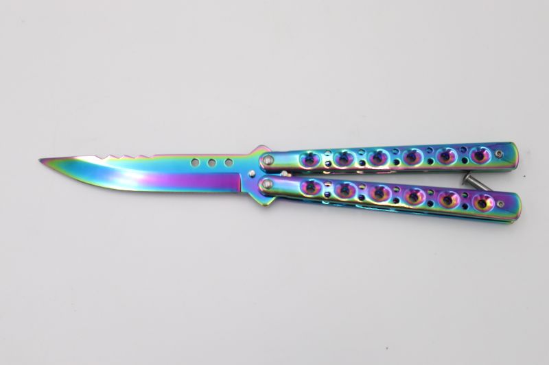 Photo 1 of OIL SLICK BUTTERFLY KNIFE NEW