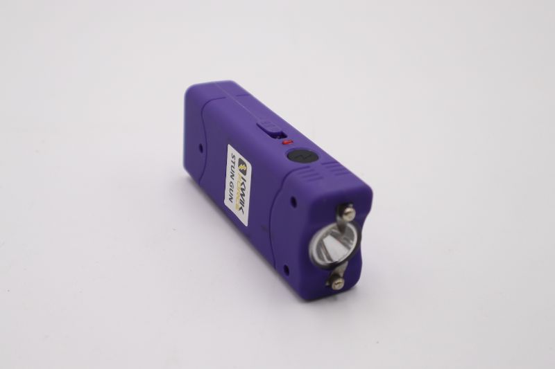 Photo 1 of PURPLE 3.75 INCH KWIK FORCE STUN GUN AND FLASHLIGHT CARRY CASE ABLE TO LOOP ONTO BELT NEW