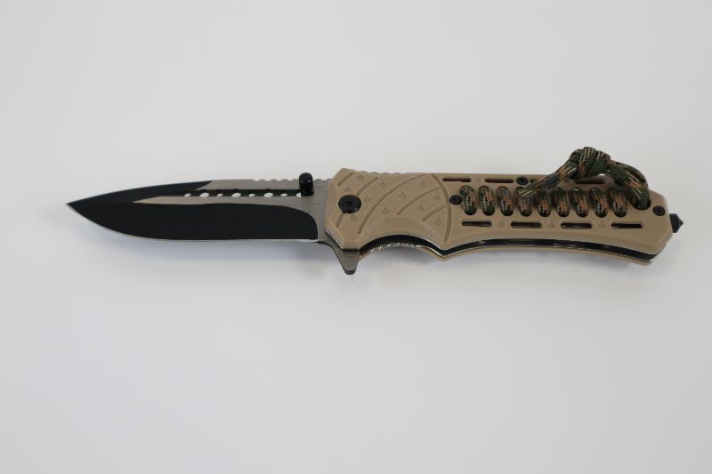 Photo 1 of BEIGE POCKET KNIFE WITH CAMO ROPE STRING ATTACHED NEW