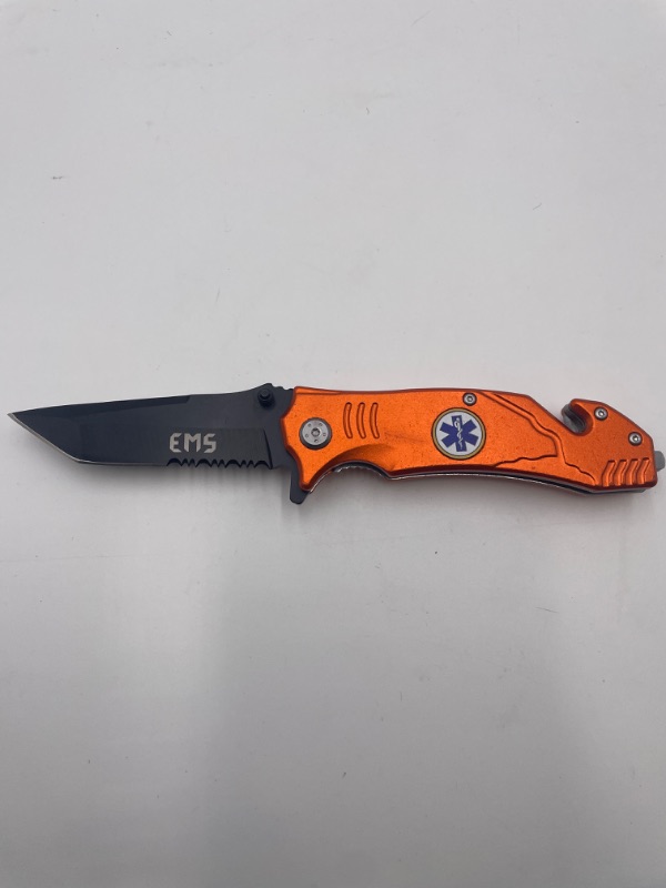 Photo 2 of ORANGE EMS POCKET KNIFE WITH WINDOW BREAKER AND QUICK HOOK TO CUT NEW 