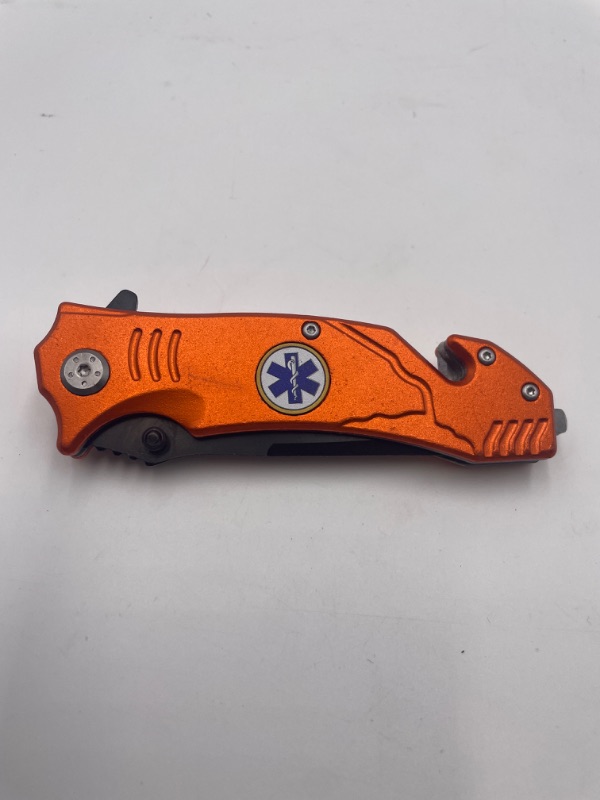 Photo 1 of ORANGE EMS POCKET KNIFE WITH WINDOW BREAKER AND QUICK HOOK TO CUT NEW 