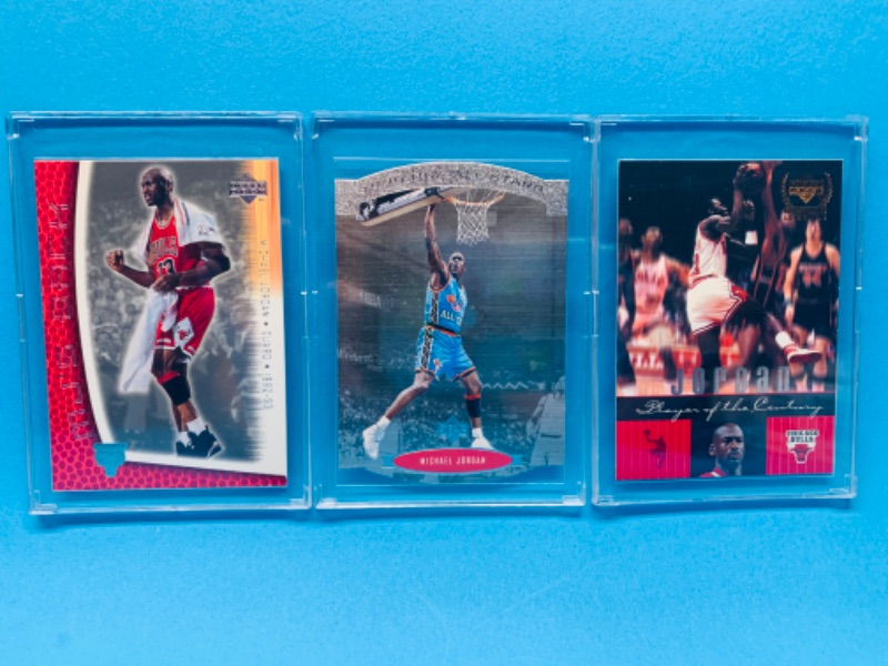 Photo 1 of 257573…3 collectible Michael Jordan cards in hard plastic cases 