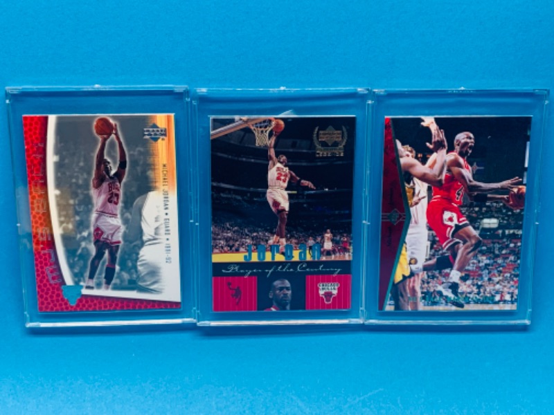 Photo 1 of 257575… 3 collectible Michael Jordan cards in hard plastic cases 