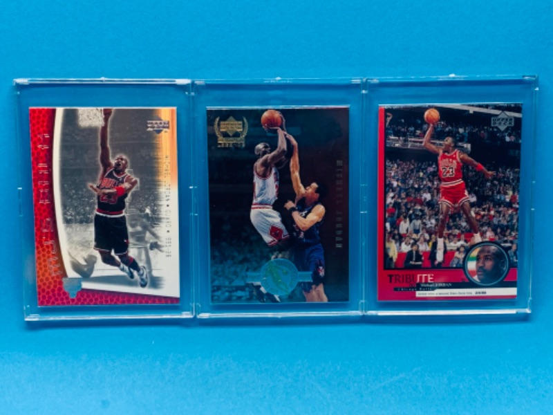 Photo 1 of 257576… 3 collectible Michael Jordan cards in hard plastic cases 