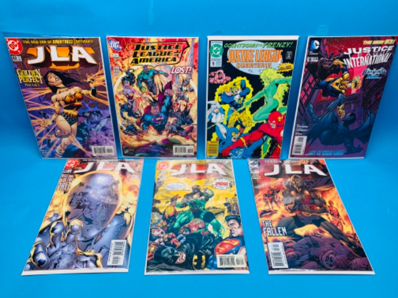 Photo 1 of 258731…7 justice league of America comics in plastic sleeves