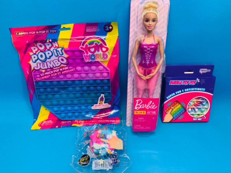Photo 1 of 259975…4 piece- Barbie and pop it toys