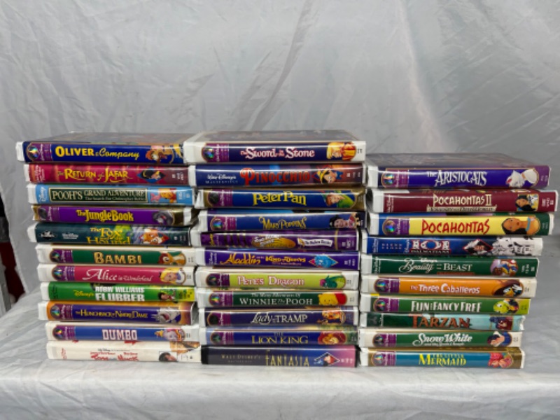 Photo 1 of 32 Disney VHS tapes 