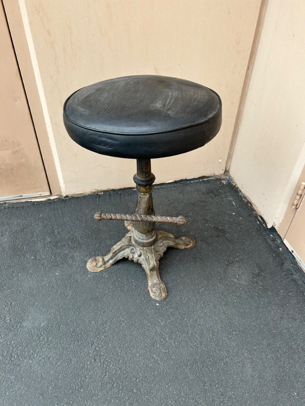 Photo 1 of Cast iron vintage slot stool measures 26 x 17 inches