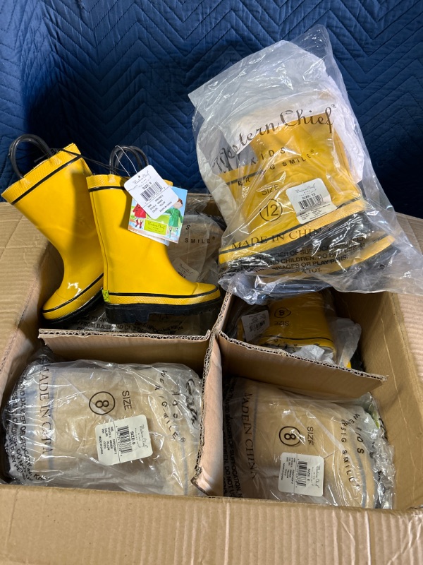 Photo 1 of Case of new Kids  Western Chief fire chief rain boots 8 pairs of size 8 and 1 pair size 12, 9 pairs total 