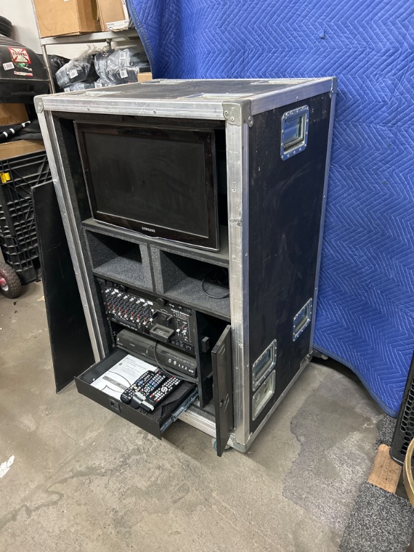 Photo 1 of Rolling road case 30 x 24 x 52 " tall opens both side and has Samsung monitor and Magnavox DVR MDR513H and Tascam DV-D01U dvd player and  Alesis imultimix 9r and Furman PL-80 with remotes and drawer