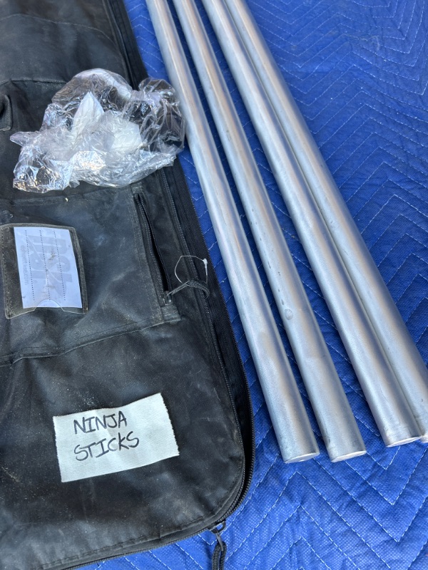 Photo 2 of Light weight 6 foot  metal sticks in travel bag marked Ninja sticks 