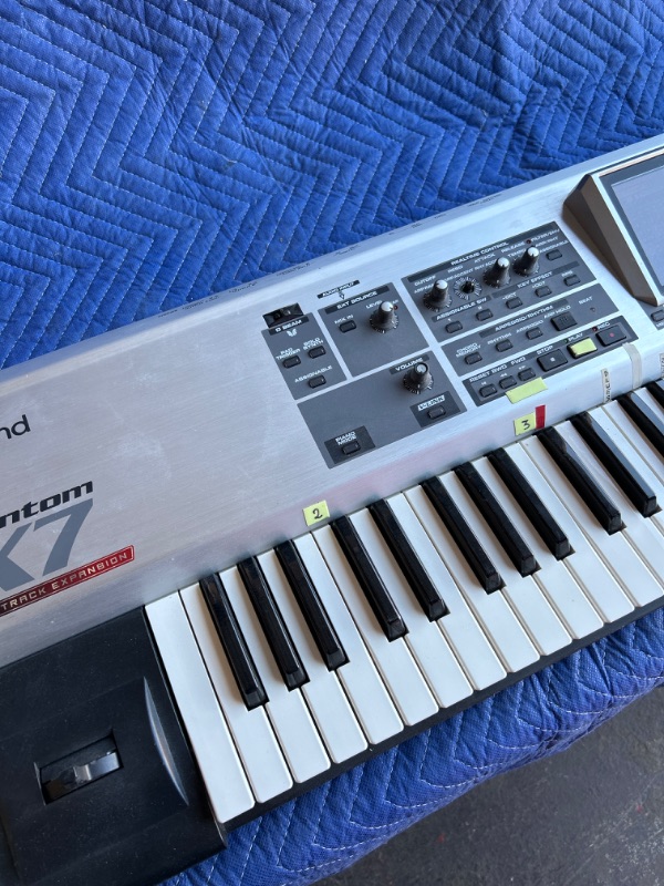 Photo 3 of Roland Fanton X7 76 key workstation keyboard plugged in powers up no further testing missing knob in heavy duty road case with wheels measures 63 x 16 x 11 inches