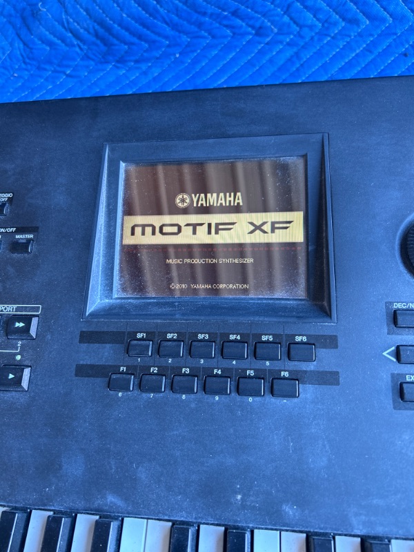 Photo 2 of Yamaha MOTIF XF8 Synthesizer Workstation 88 Weighted Key Keyboard plugged in powers on no further testing done dusty from warehouse 