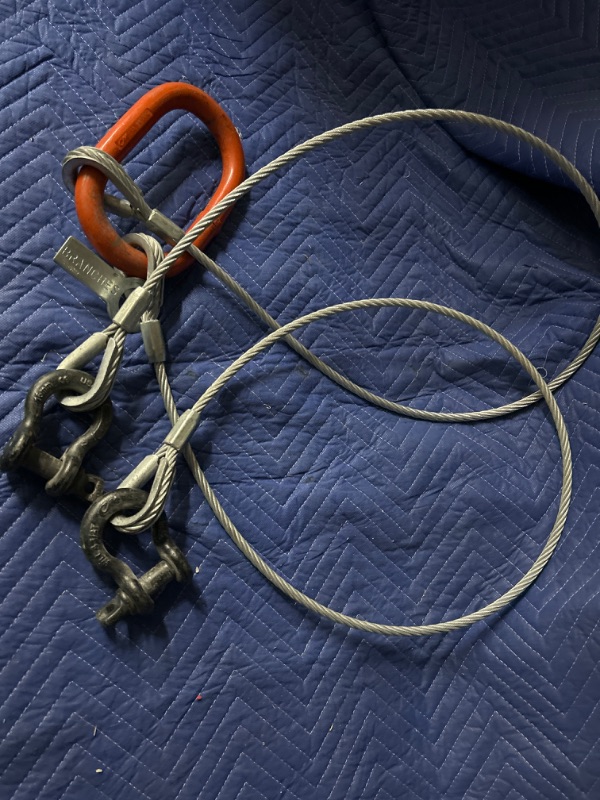 Photo 1 of Two  5 foot 3/8 cable on ring with shackles 