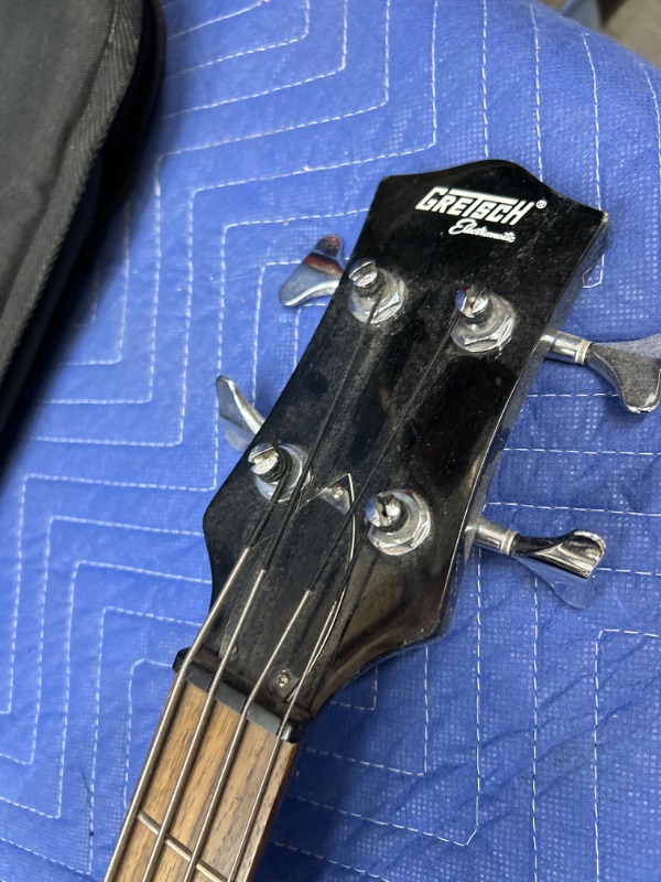 Photo 2 of Gretsch electromatic bass guitar in soft case has a couple of small chips in body 