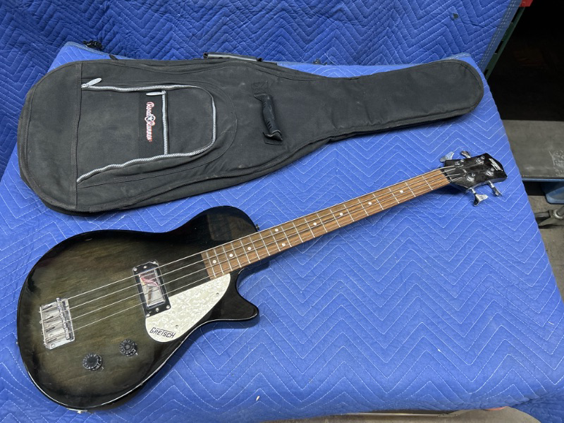 Photo 1 of Gretsch electromatic bass guitar in soft case has a couple of small chips in body 