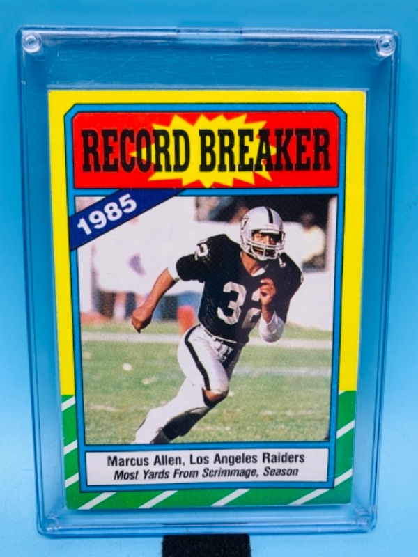 Photo 1 of 277732…topps 1986 Marcus Allen most yards from scrimmage record breaker card 1  in hard plastic case