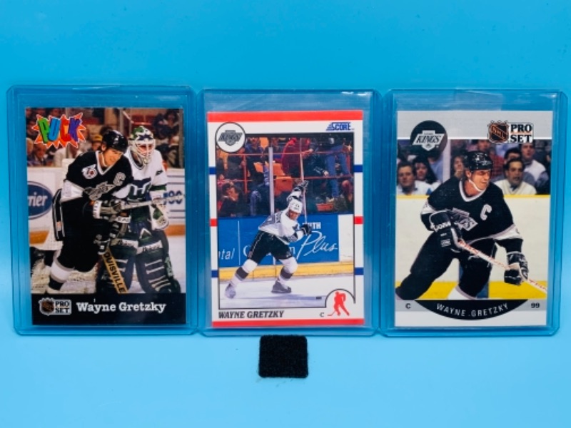 Photo 1 of 277737… three Wayne Gretzky trading cards in  hard plastic sleeves