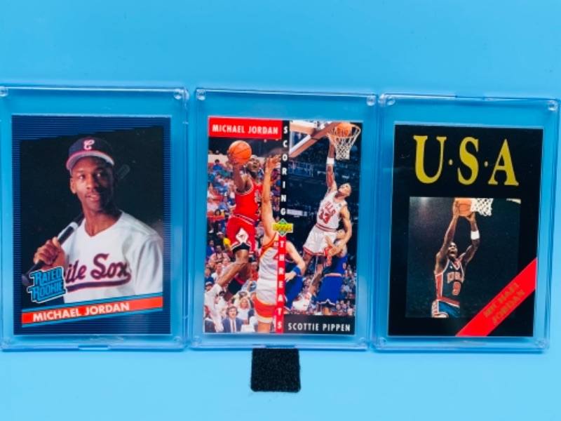 Photo 1 of 277741… three Michael Jordan trading cards in hard plastic cases