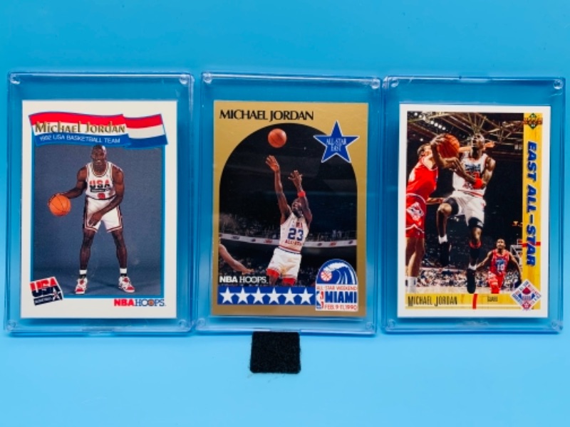 Photo 1 of 277742… three Michael Jordan trading cards in hard plastic cases