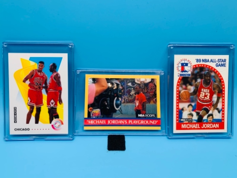 Photo 1 of 277743… three Michael Jordan trading cards in  hard plastic cases