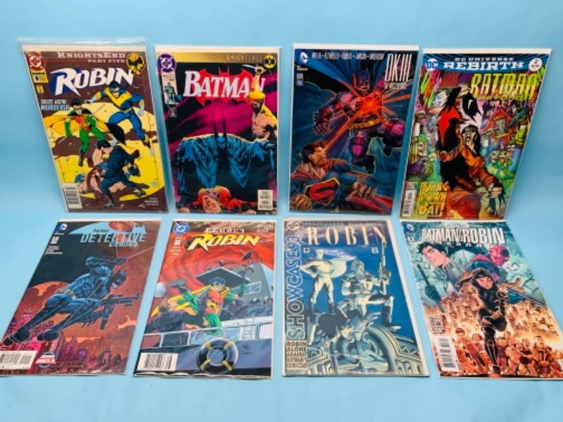 Photo 1 of 277859… eight Batman and robin comics in plastic sleeves