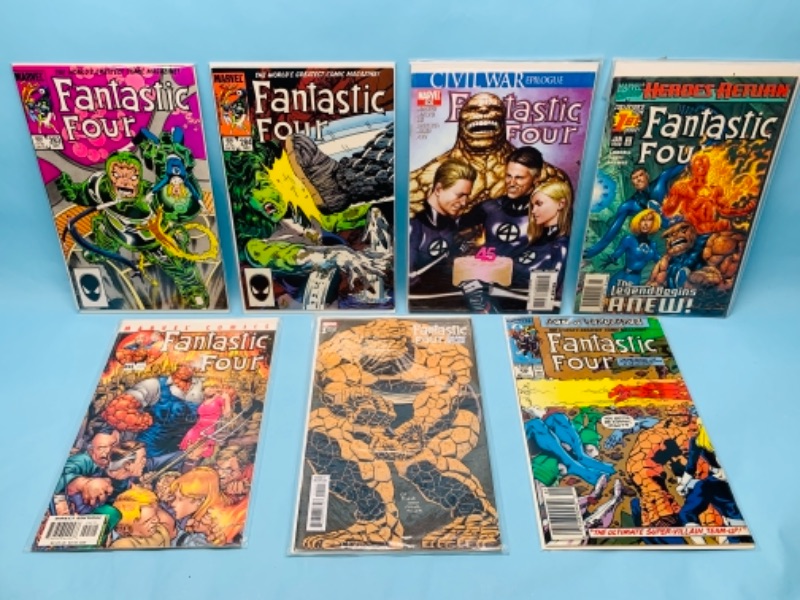 Photo 1 of 277869… seven fantastic four comics in plastic sleeves