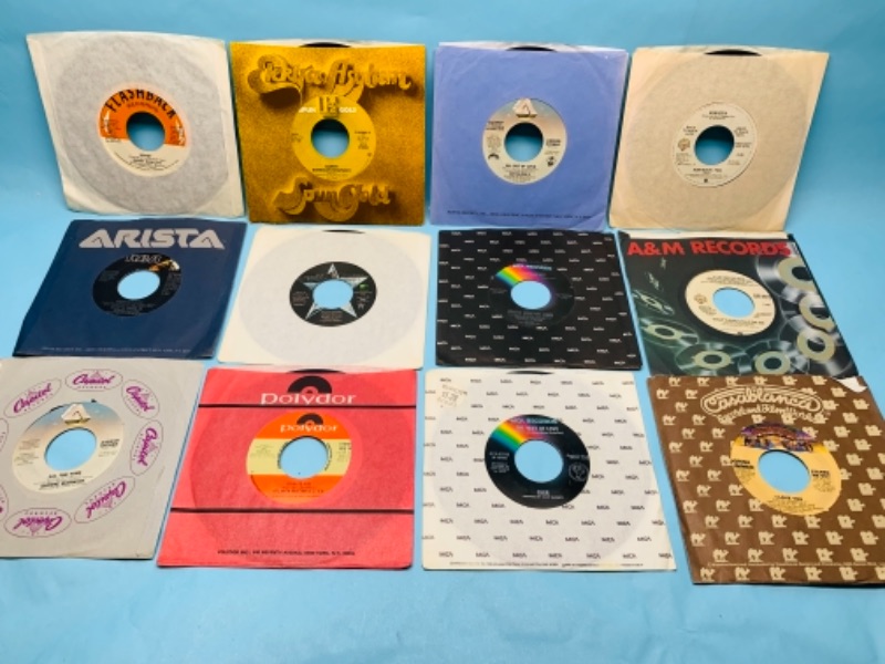 Photo 1 of 277871…12 vinyl 45 rpm records in great condition for age with sleeves 