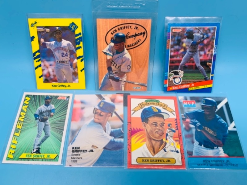 Photo 1 of 277932… seven Ken Griffey Jr.  trading cards in plastic sleeves