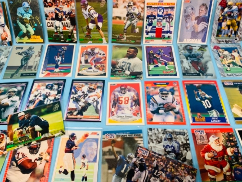 Photo 7 of 277958…75 mixed football trading cards in plastic sleeves 