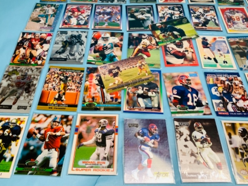 Photo 3 of 277958…75 mixed football trading cards in plastic sleeves 