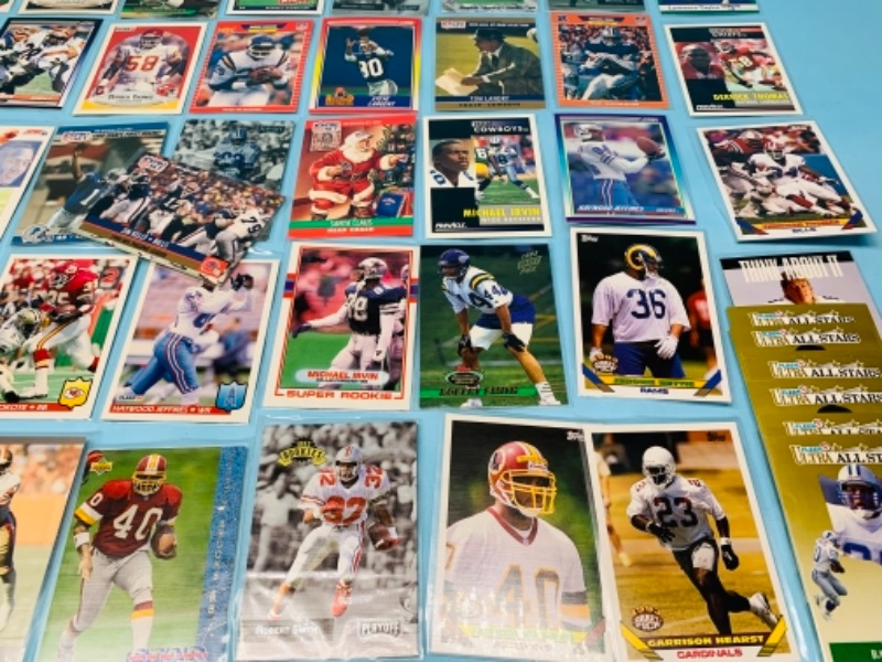 Photo 2 of 277958…75 mixed football trading cards in plastic sleeves 