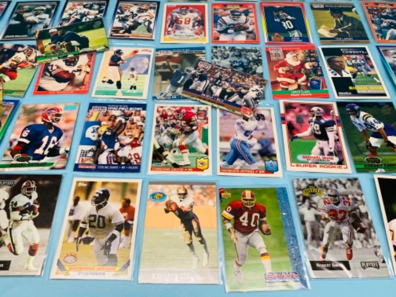 Photo 5 of 277958…75 mixed football trading cards in plastic sleeves 