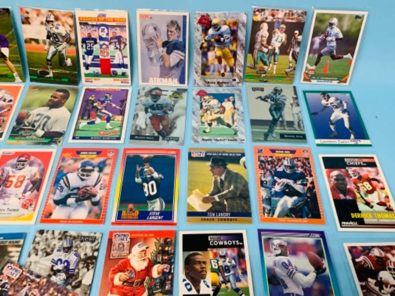 Photo 4 of 277958…75 mixed football trading cards in plastic sleeves 