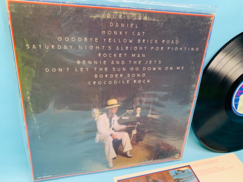 Photo 2 of 278127…Elton John greatest hits vinyl record in great condition for age in plastic sleeve 