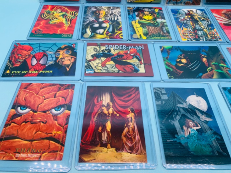 Photo 4 of 278134…25 older marvel, lady death, DC, and chromium comic trading cards in hard plastic sleeves 