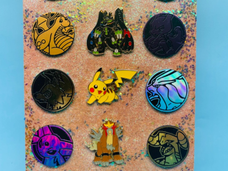 Photo 4 of 278140… collectible Pokémon pins and pogs on a cork board 