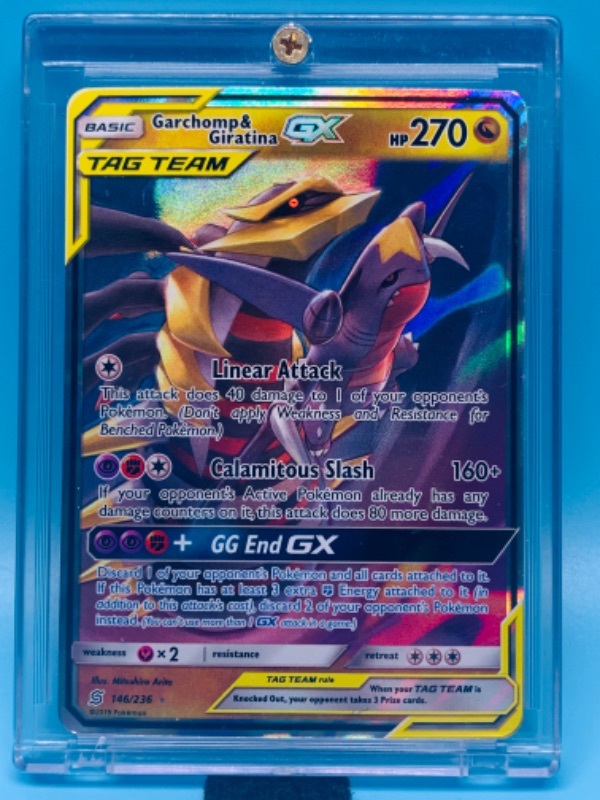 Photo 1 of 278171…Pokémon garchomp and giratini GX tag team holo card 146/236 in hard plastic case 