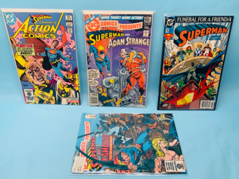 Photo 1 of 278217… four vintage Superman comics in plastic sleeves