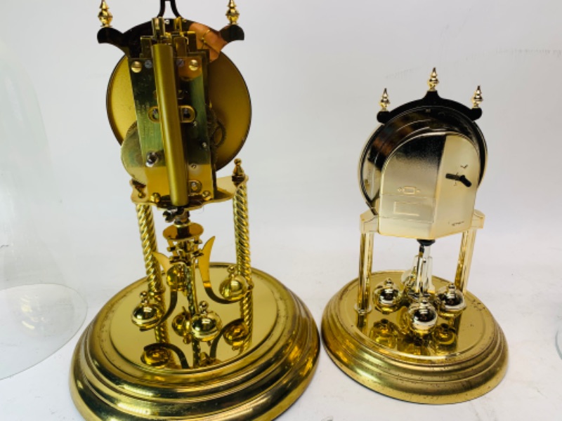 Photo 1 of 278267…two vintage mantle clocks- one brass and glass and one plastic  and glass