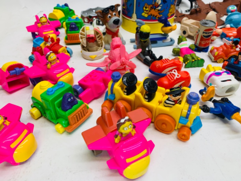 Photo 2 of 278277…vintage toys, happy meal, wind up, and others. Dreamtime carousel needs disc- not complete 