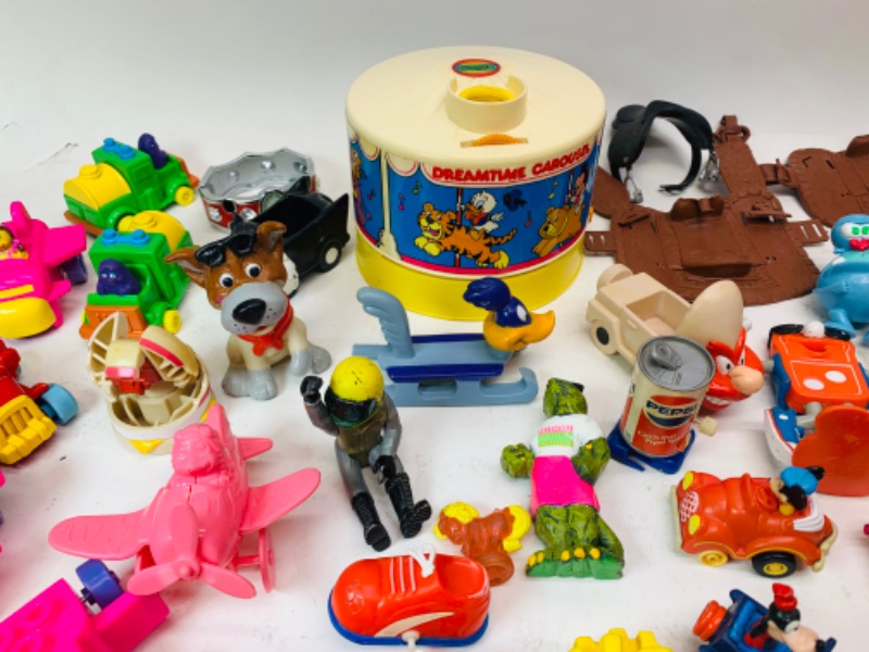 Photo 6 of 278277…vintage toys, happy meal, wind up, and others. Dreamtime carousel needs disc- not complete 